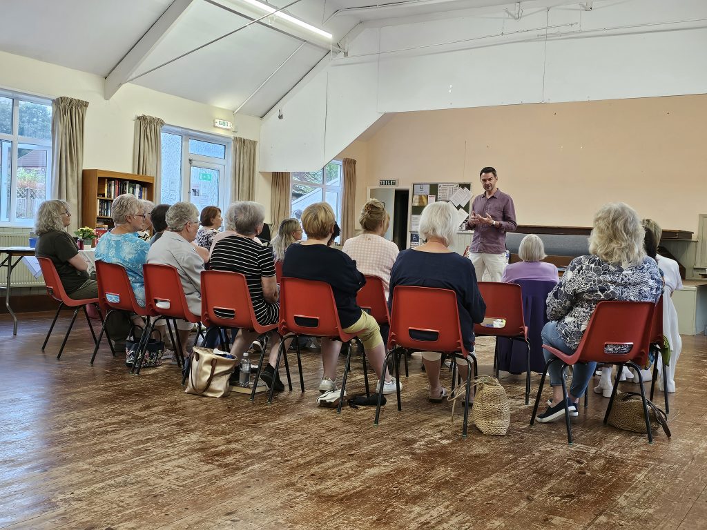 Terry Mellors speaking to a group about breathing