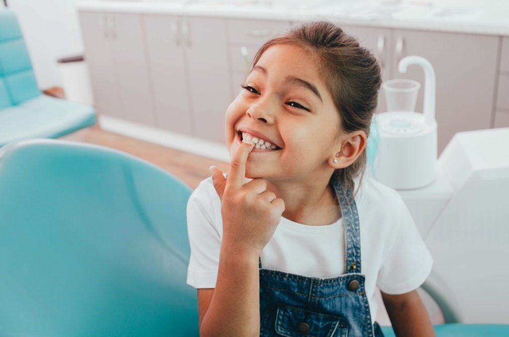 Child smiling in a dental clinic